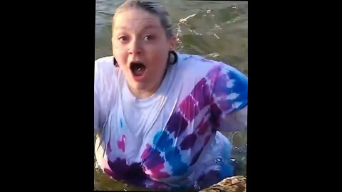 lady posing loses balance on edge of water