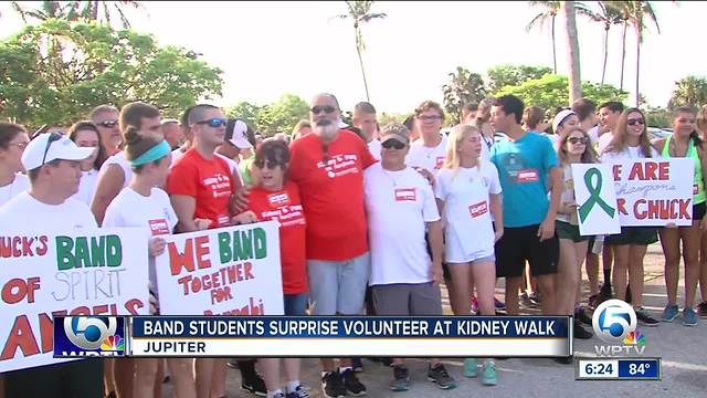 Band students surprise volunteer at kidney walk