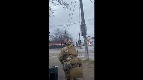 Close call! Ukrainians take a tank round next to building.