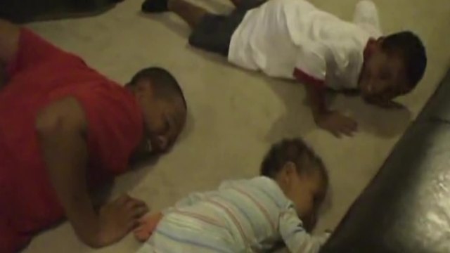 Baby Boy Doing Push Ups With His Older Brothers