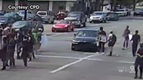 Driver moves car into line of protesters at City Hall