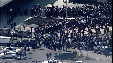 Deputy Jacob Pickett's body loaded into the hearse for his procession