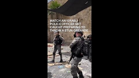 WATCH AN ISRAELI POLICE OFFICER GET CAUGHT PREPARING TO THROW A STUN GRENADE