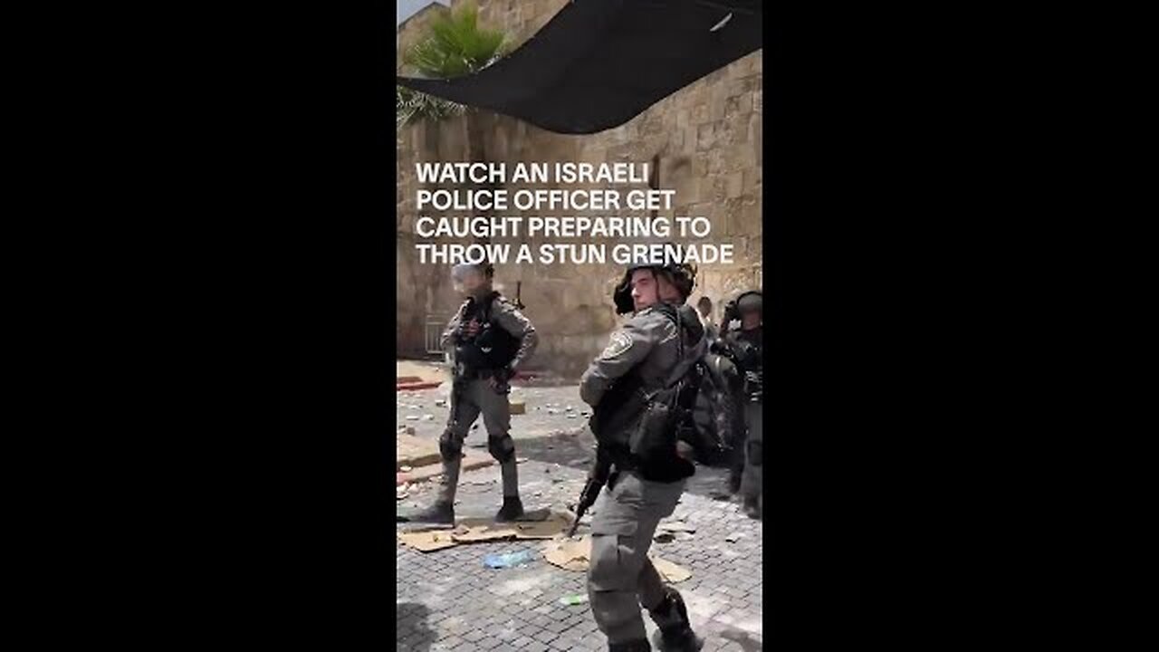 WATCH AN ISRAELI POLICE OFFICER GET CAUGHT PREPARING TO THROW A STUN GRENADE