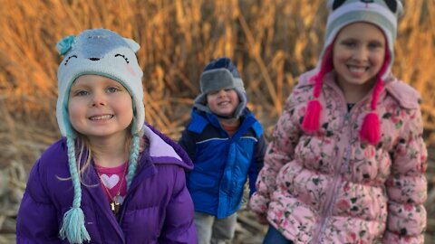 The kids picking corn at Uncle Brent’s