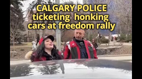 CALGARY POLICE ticketing honking cars at rally