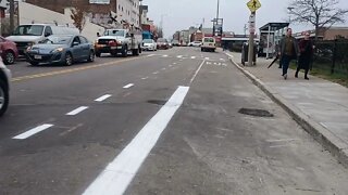 Construction worker repainting the bike lane lines after finishing work