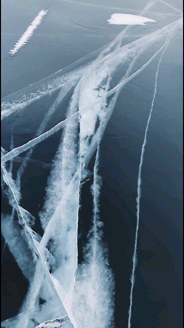 Big cracks across a frozen lake