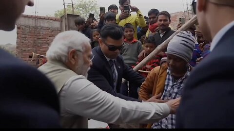 Prime Minister Modi drinking tea at a common man's house