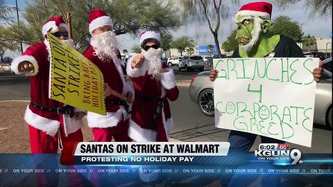 Santas on strike outside local Walmart