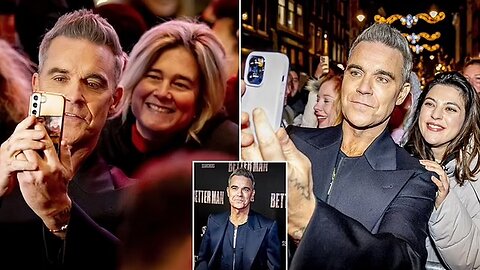 "Robbie Williams Poses for Fans at Premiere"