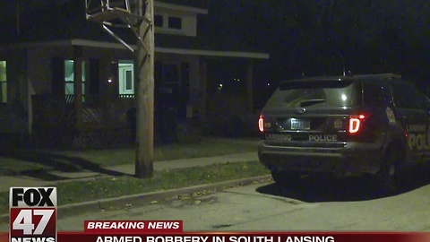 Police search for two men after armed robbery in Lansing