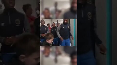 kid lead his favorite soccer team Cape Town City down the tunnel with a glorious motivating chant