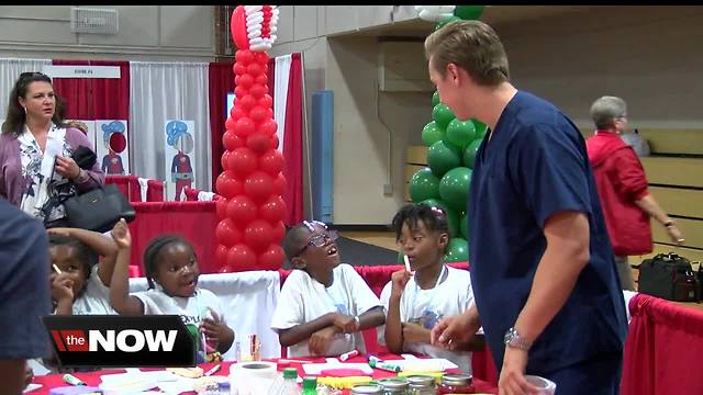 Women's group offers free dental screenings for kids at health and safety fair in Indy