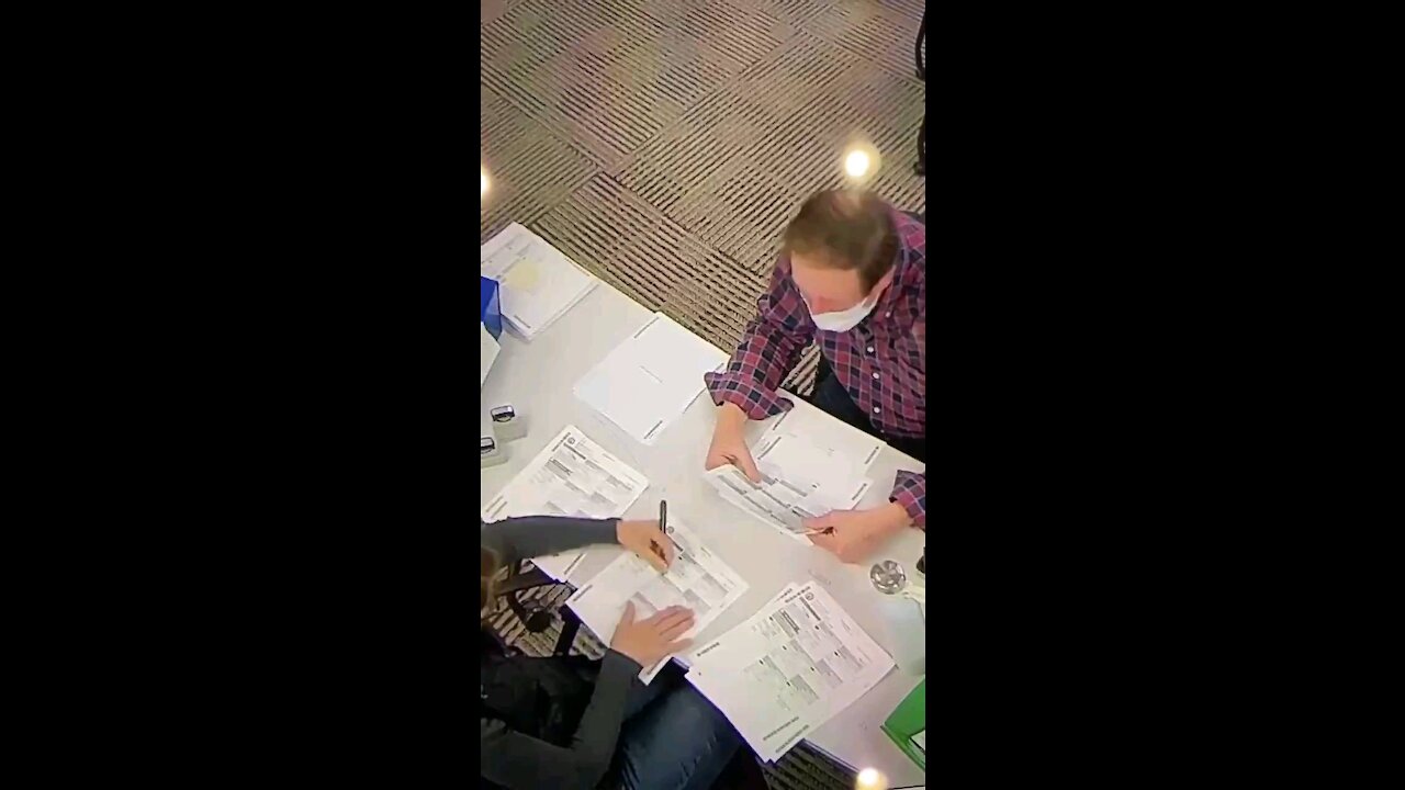 Lady Fills Out Several Ballots. Caught on Camera.