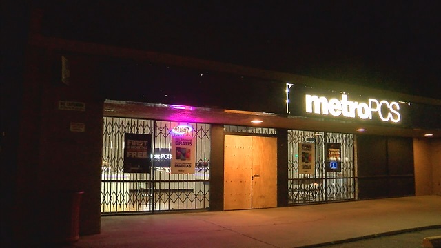 Bandit and customer trade shots at a store robbery