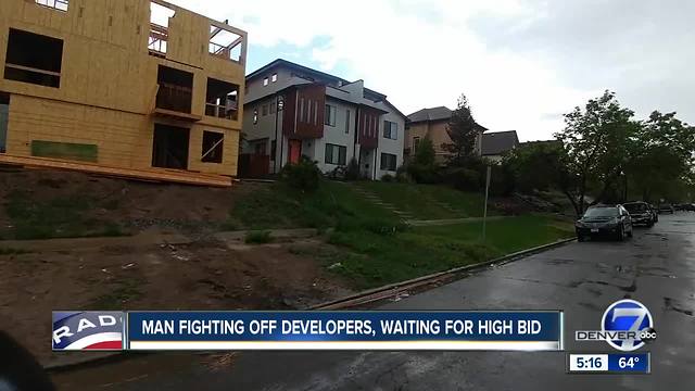 Man fighting off developers, waiting for high bid