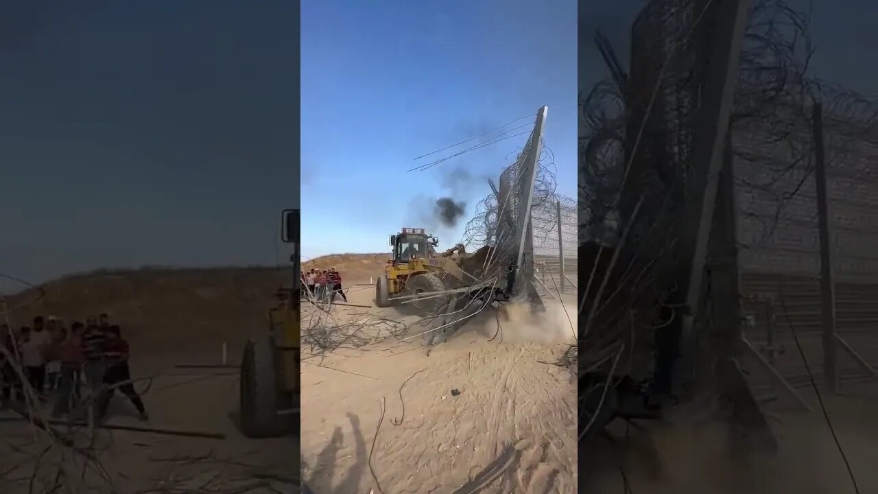Palestinians using Payloader to remove the separation wall on the Gaza Strip border