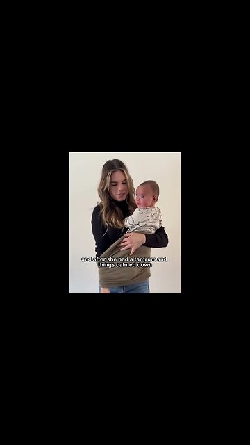 Place your child inside, then bring your arm through one side of the loop.