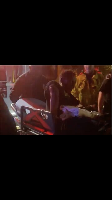 Chappelle’s Attacker Seen on Gurney with Grotesques Arm Injury