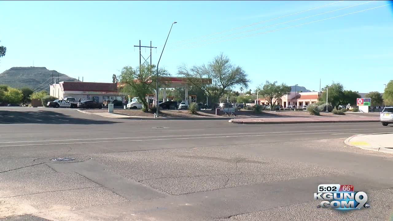 Armed robber assaults two store clerks