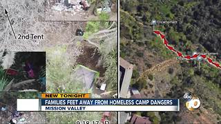 Families living feet from homeless camp dangers