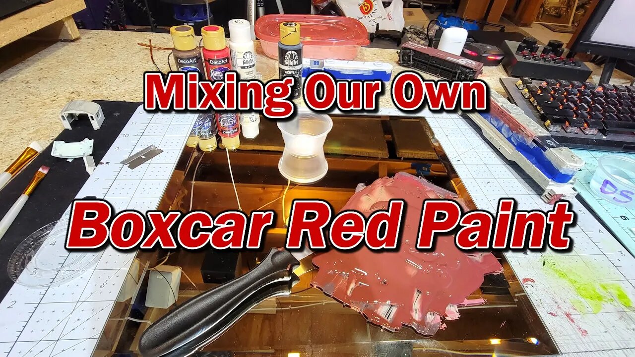 Mixing our own Boxcar Red from craft paint