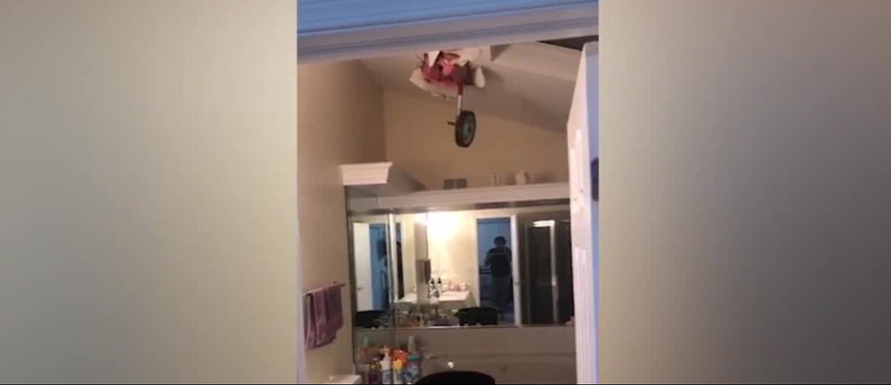 Tire comes through roof of home