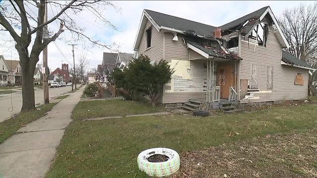 Years after a house went up in flames, neighbors fight to have the eyesore demolished