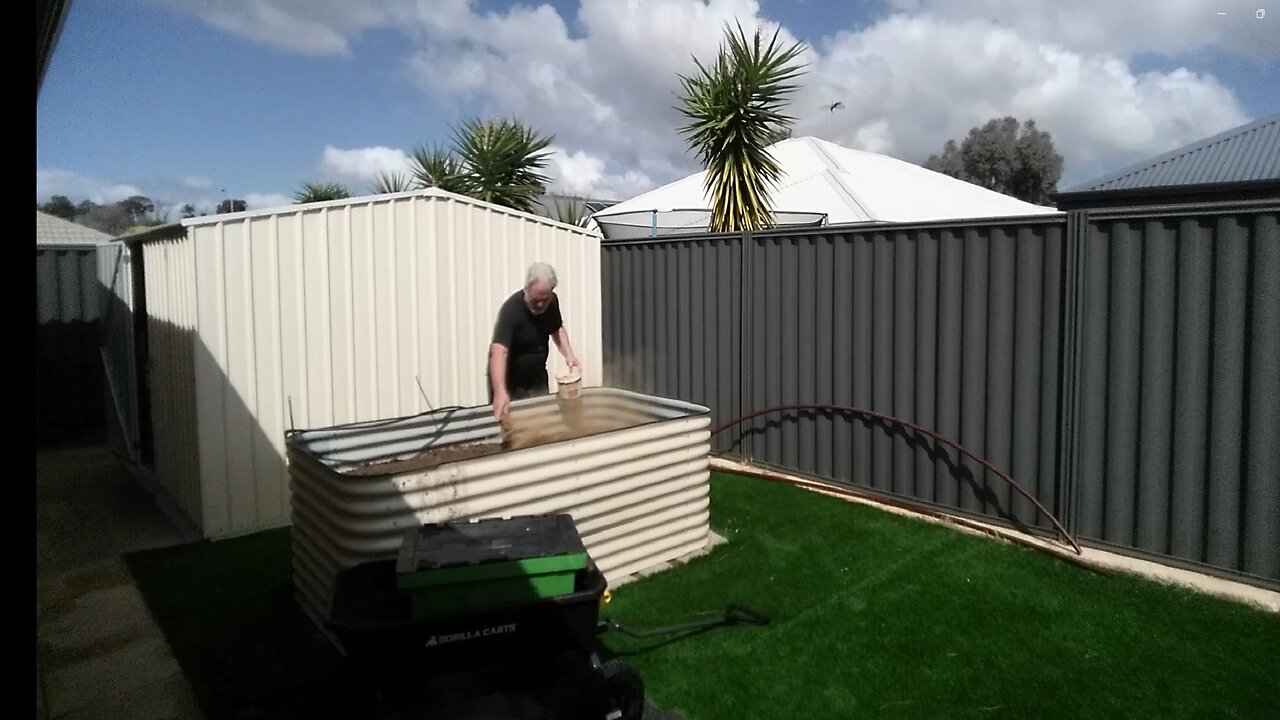 Topping up the raised bed - Another Honey do project.