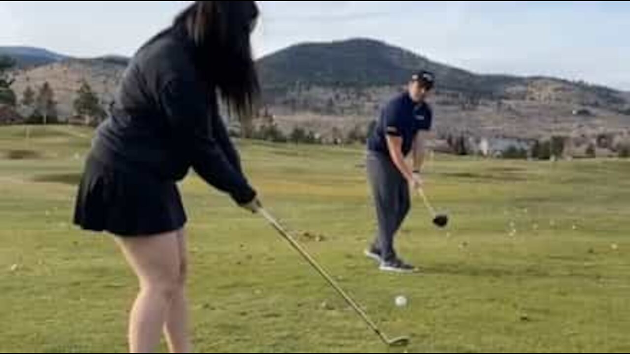 Golfer and girlfriend pull amazing trick shot