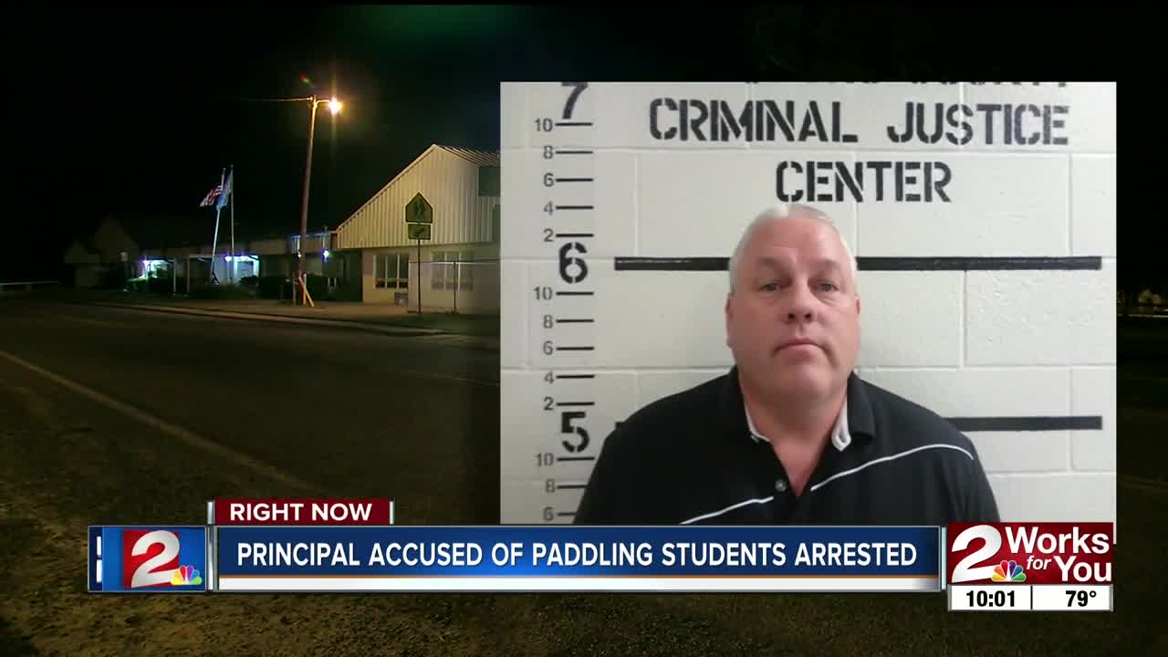 Principal accused of paddling students arrested