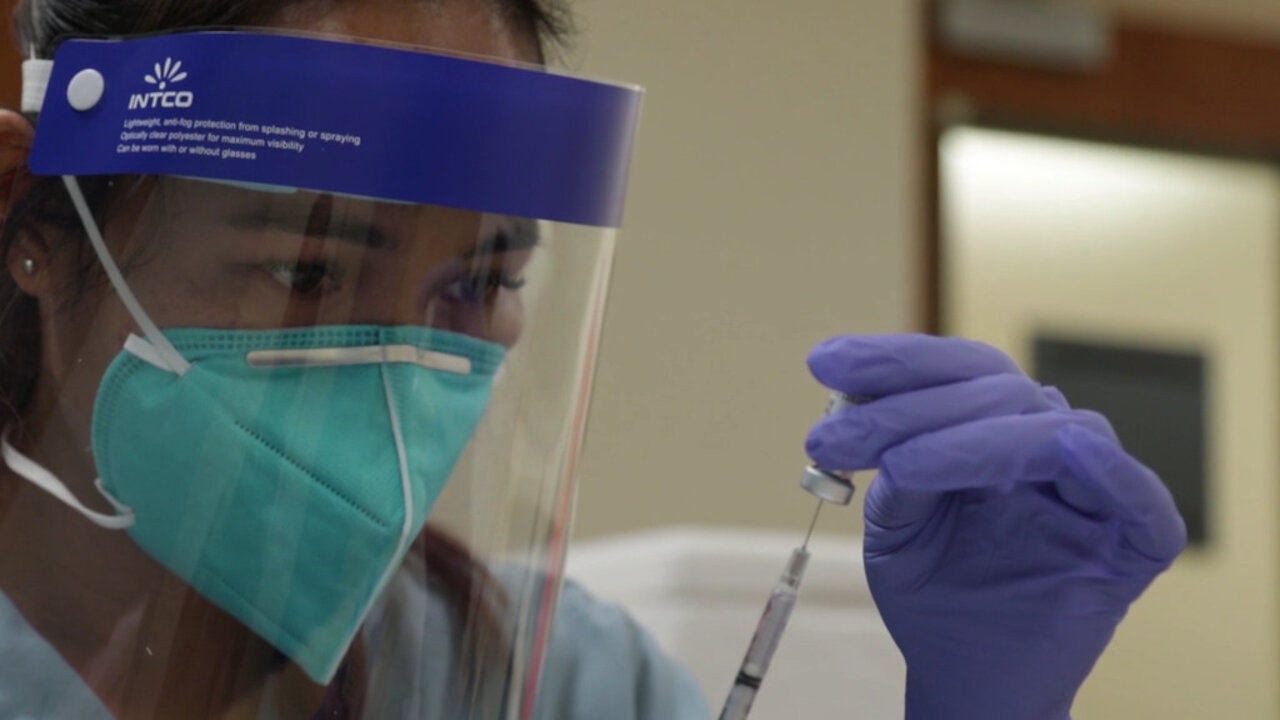 Air Force Capt. Jeanette Hughes draws COVID-19 vaccine for Adventist Health White Memorial staff