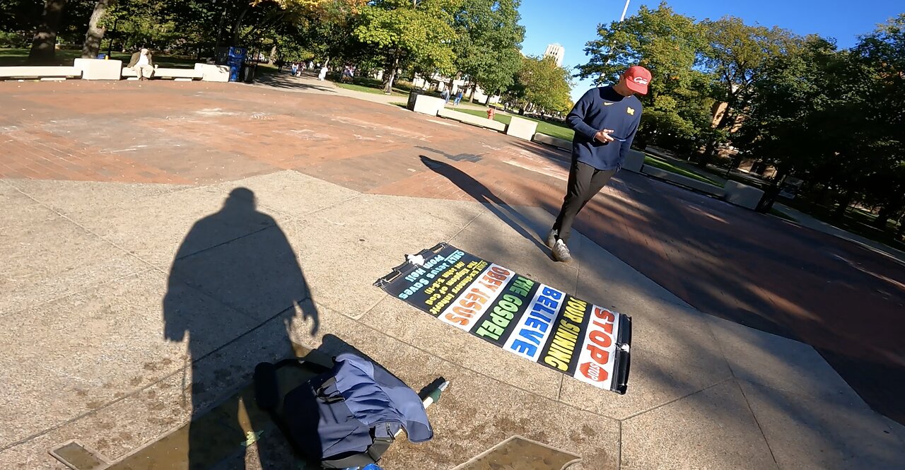 Univ of Michigan: Rebuking Mocker As The Holy Spirit Gives Me A Word of Knowledge/Wisdom For This Mocker, Curious Student Examines My Banner, Takes Pics, Multitudes, Multitudes In The Valley of Decision, I Warn of The Coming Judgments Upon the USA!