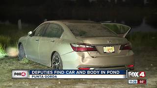 Body recovered from car submerged in pond