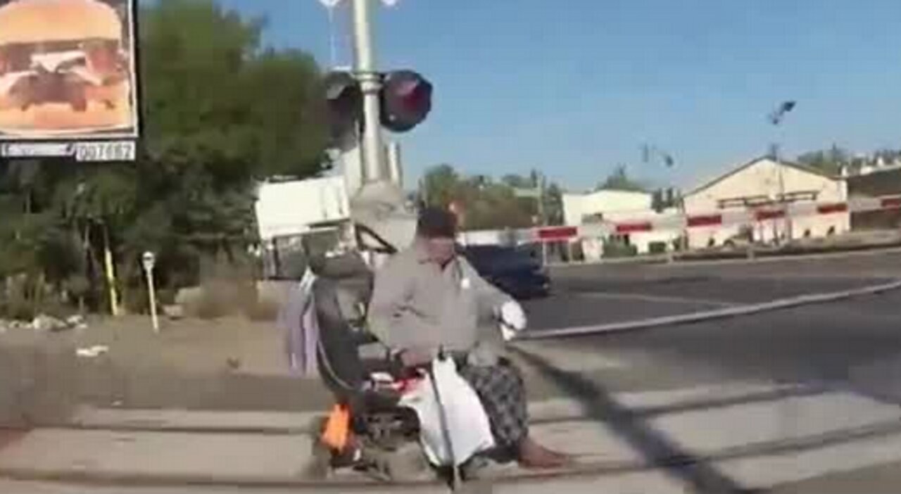 California police officer saves man from getting hit by train