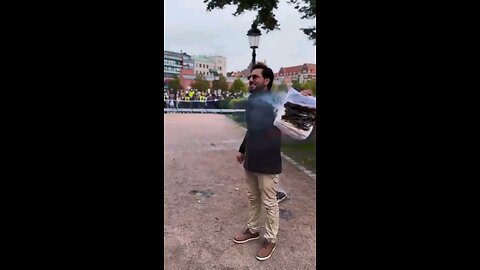Swedish Man Burn Koran in front of a crowd of Muslims, tells them to "Go Back to their Islamic...