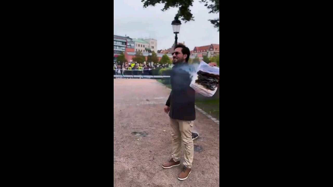Swedish Man Burn Koran in front of a crowd of Muslims, tells them to "Go Back to their Islamic...
