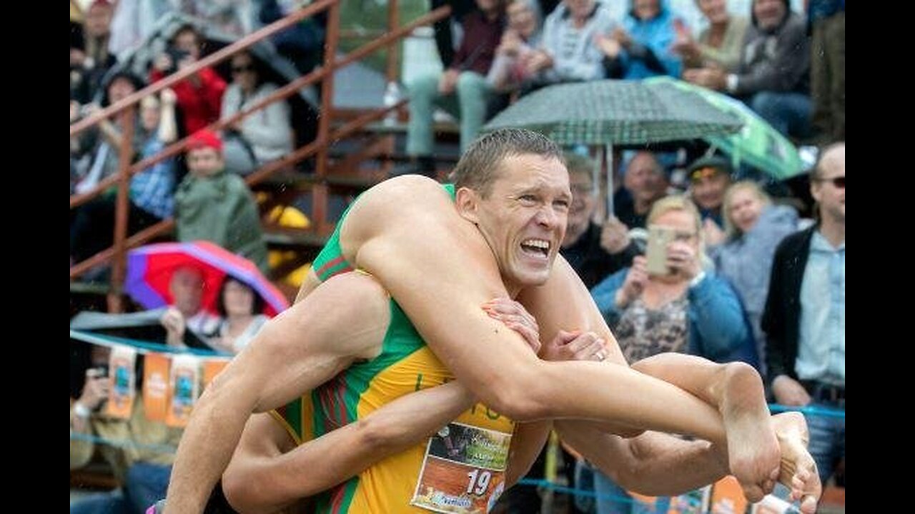 Champion Claims Wife's Weight in Beer at Wife Carrying Contest!