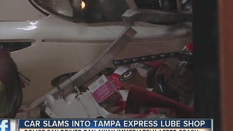 Car slams into Tampa express lube shop