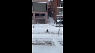 Snowmobile spotted in the snow on Euclid Avenue