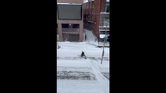 Snowmobile spotted in the snow on Euclid Avenue