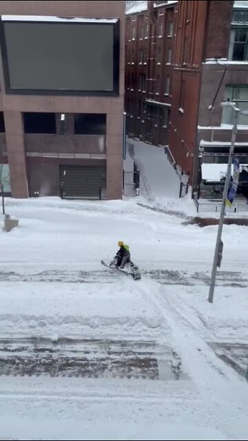 Snowmobile spotted in the snow on Euclid Avenue