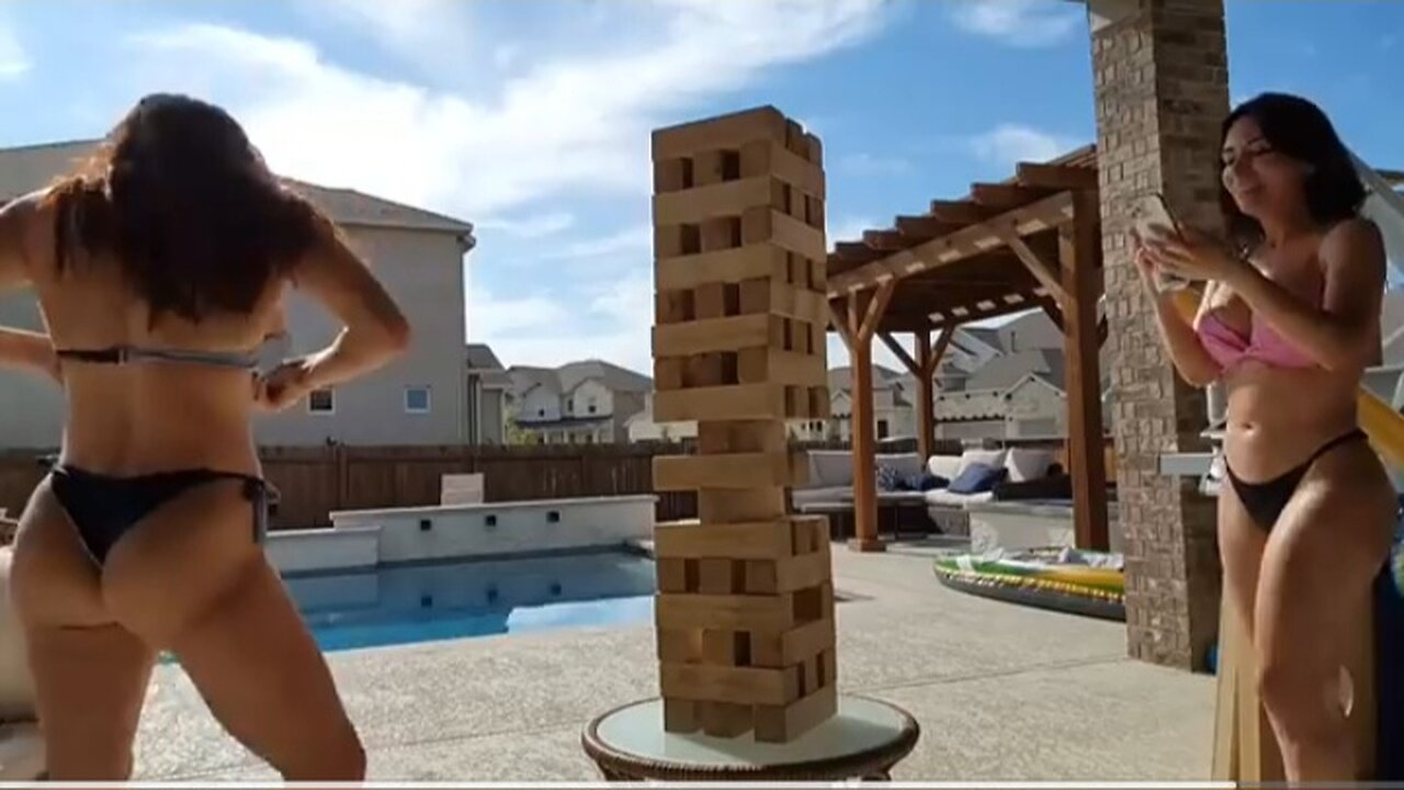 2 friends building a block tower