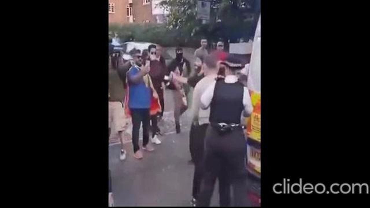 WHITE WOMAN POLICE CONSTABLE USES WHITE ARRESTEE AS HUMAN SHIELD AS MUSLIMS VIOLENTLY ATTACK HIM