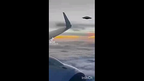 Alien craft fires something next to airplane.