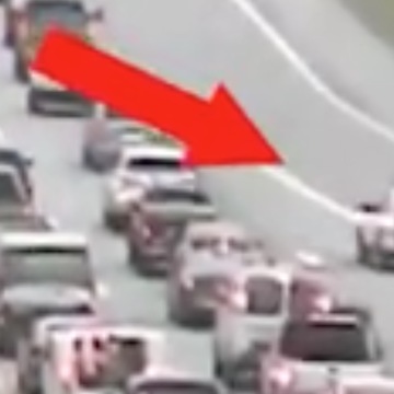 SUV Ducked Traffic By Driving Backwards Out Of It — DANGEROUS!