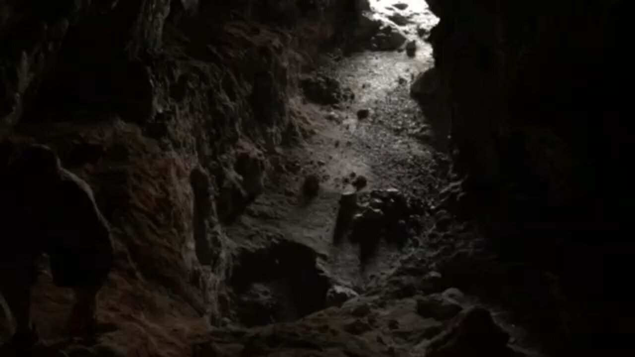 Locals playing Ukulele/guitar in shark cave