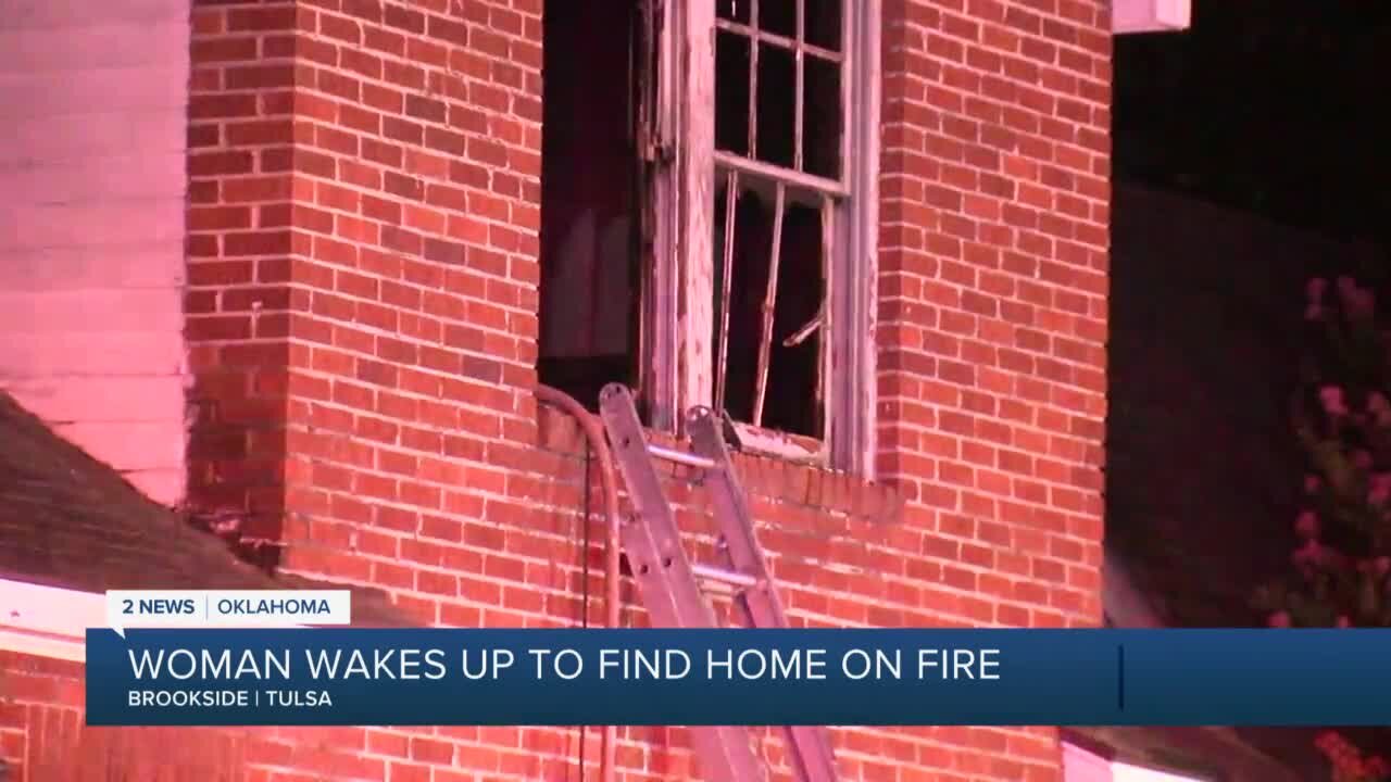 Tulsa woman wakes up to find neighbor's home on fire