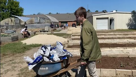 Daniel Hauls a Wheelbarrow